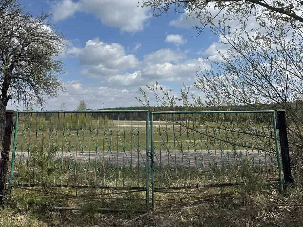 Restoring Not Resetting Life -garden-gate view beyond into the farming landscape
